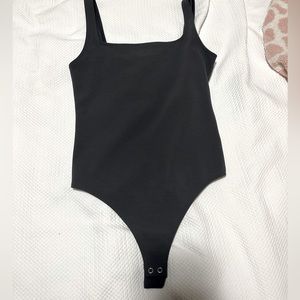 Express Grey bodysuit. Looks darker but is a little lighter grey than pictured.
